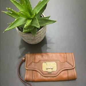 Gently loved Cole Haan wristlet in tan leather
